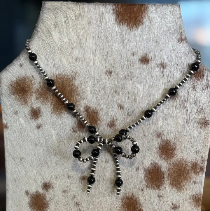 Navajo Pearl Bow with Onyx